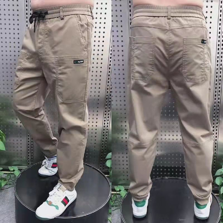 Men's sporty cargo jogger pants with elastic waistband, drawstring, and tapered leg hem StylebySassy