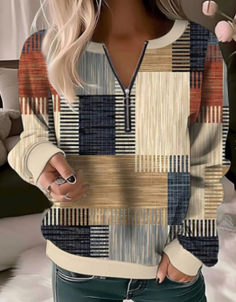 Women's cozy sweater with short zip, graphic patchwork pattern, extended sleeve cuffs, and ribbed hem StylebySassy