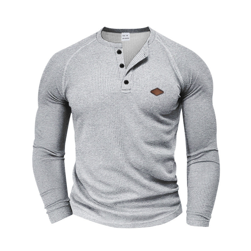 Men's structured waffle Henley shirt with short button placket, raglan sleeves, and leather patch StylebySassy
