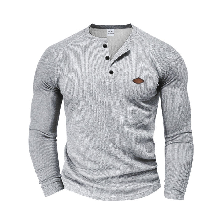 Men's structured waffle Henley shirt with short button placket, raglan sleeves, and leather patch StylebySassy