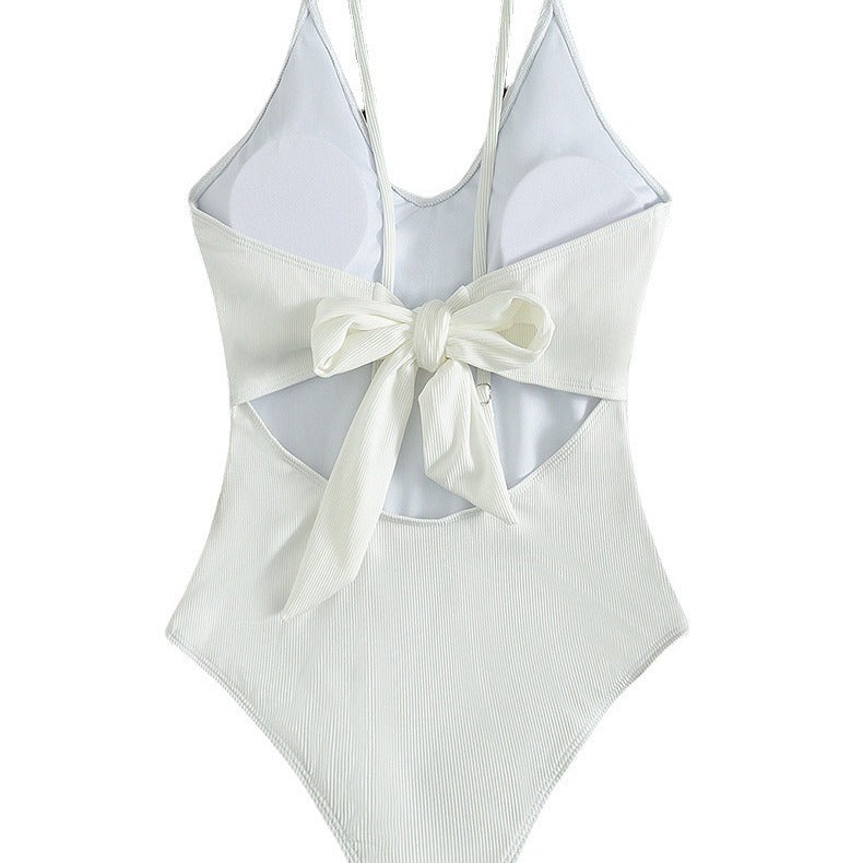 Women's one-piece swimsuit with deep V-neckline and fine ribbed texture StylebySassy