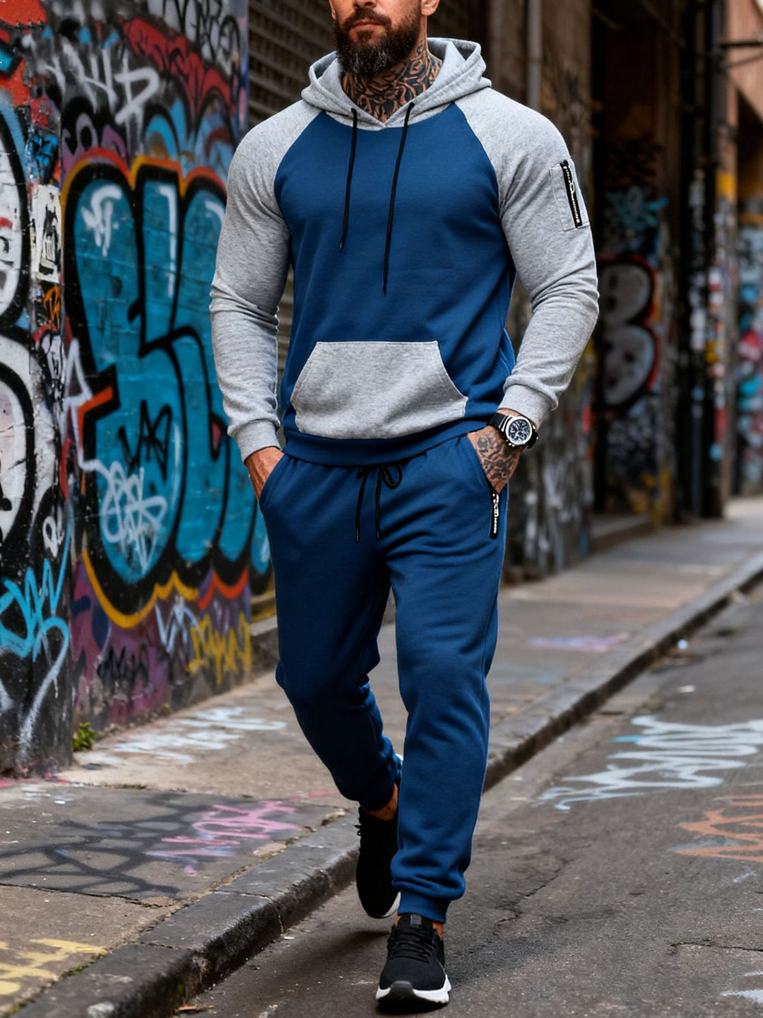 Men's two-piece hooded sweat set with raglan sleeves, sleeve zip pocket, and tapered jogging pants StylebySassy