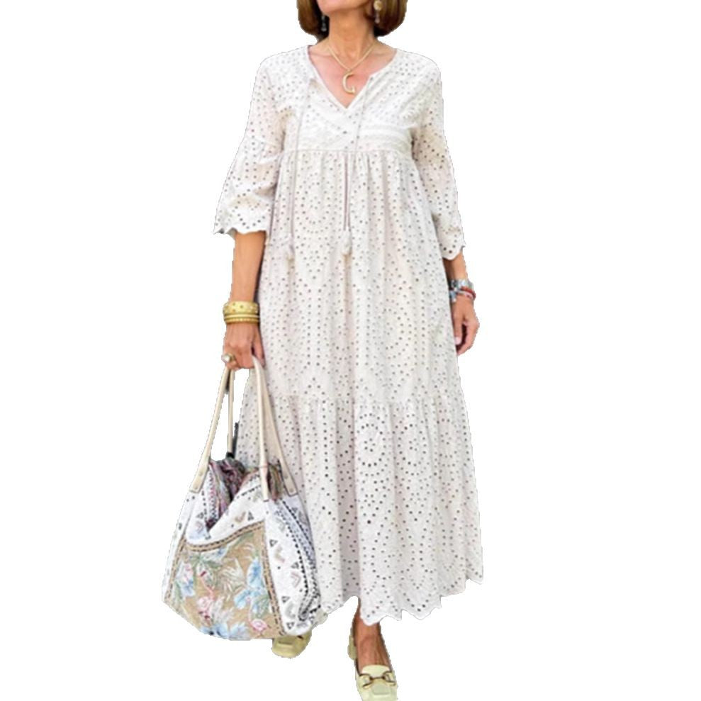 Women's flowing maxi dress with openwork embroidery, V-neck, underbust seam, and ruffled skirt StylebySassy