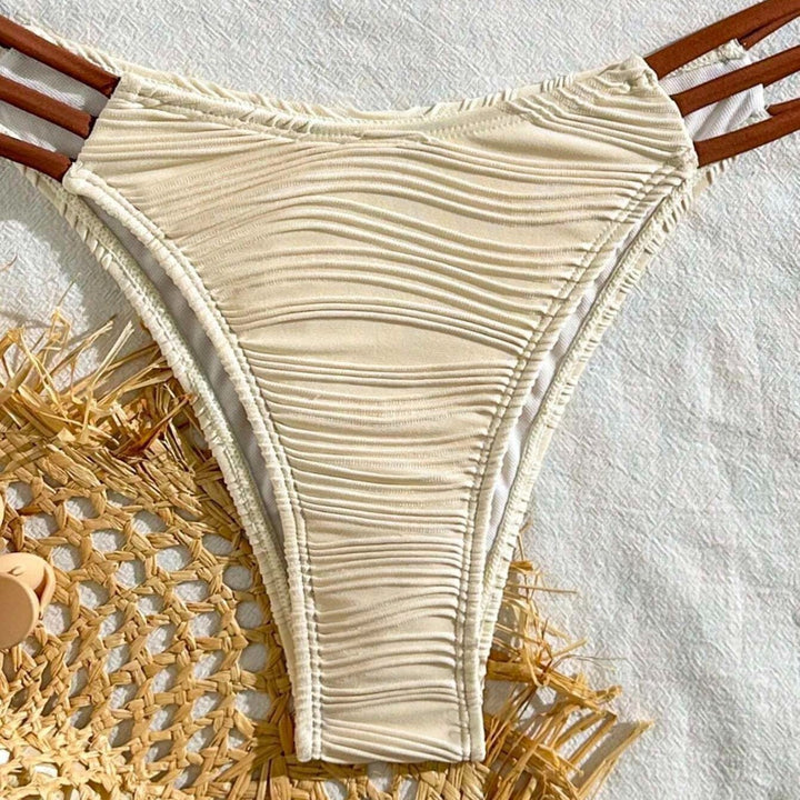 Women's triangle bikini with elegant gathering design and trendy strap details StylebySassy