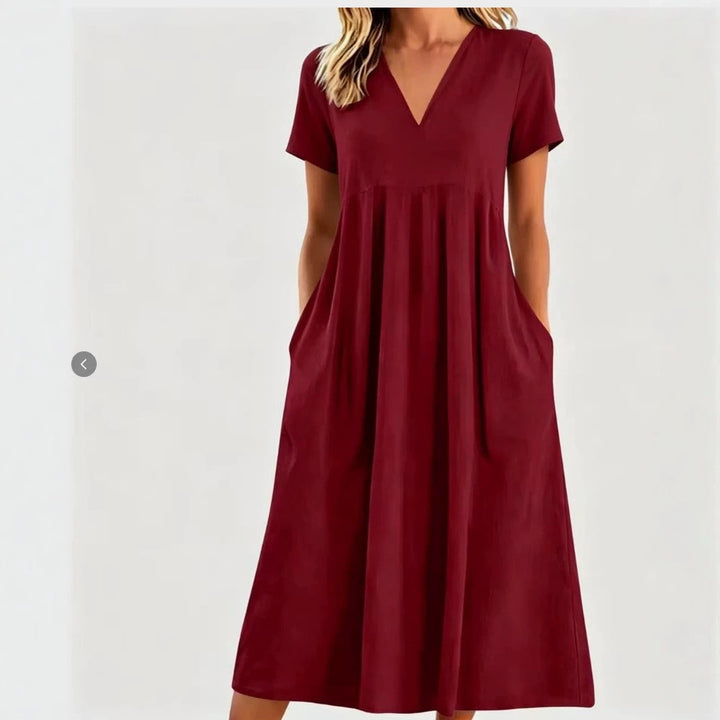 Women nan legeres V-neck midi dress with side pockets and gathered empire seam StylebySassy