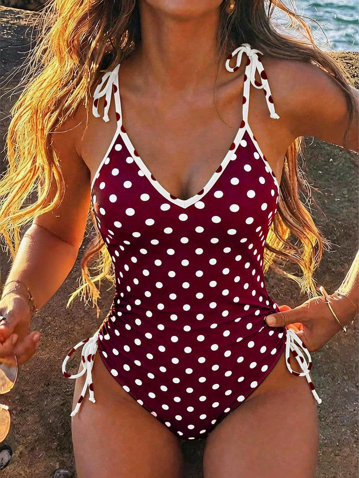Women's one-piece swimsuit with playful polka dot design StylebySassy
