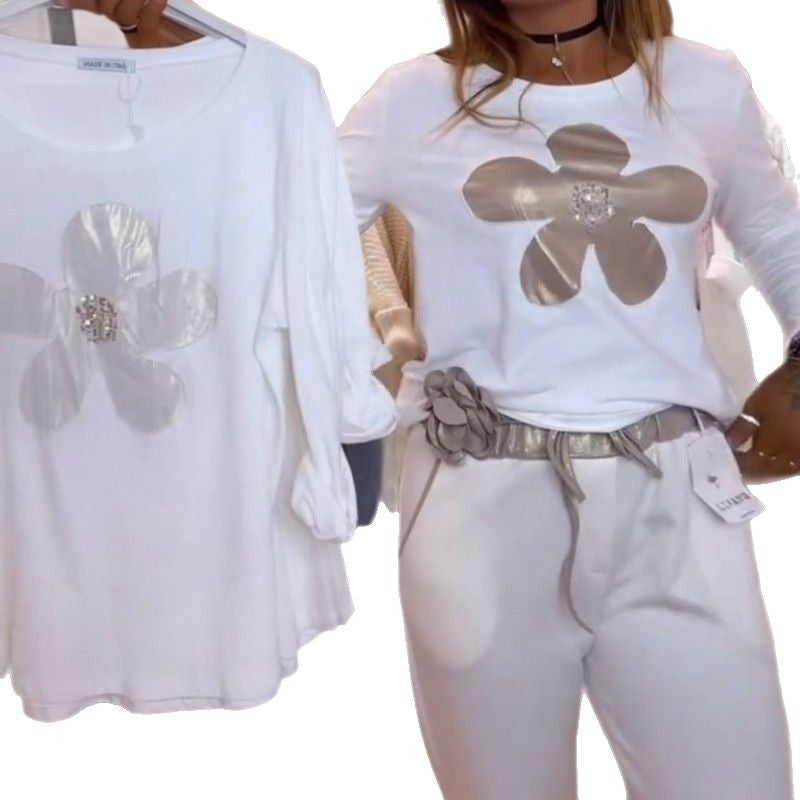 Women's locker-cut long-sleeve shirt with shiny flower appliqué and rhinestone center StylebySassy