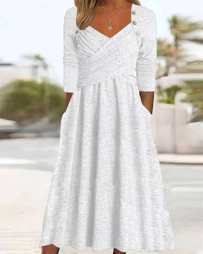 Women's knitted maxi dress with wrap top V-neck, side pockets and decorative button placket StylebySassy