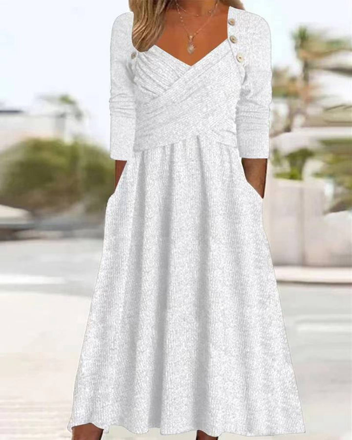 Women's knitted maxi dress with wrap top V-neck, side pockets and decorative button placket StylebySassy