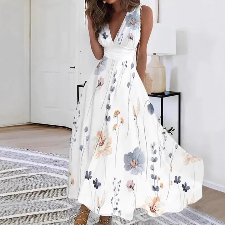 Women's flared midi dress with deep V-neck, empire waist and delicate floral print StylebySassy
