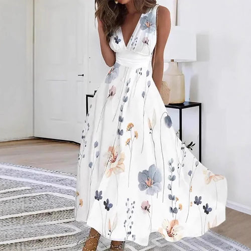 Women's flared midi dress with deep V-neck, empire waist and delicate floral print StylebySassy