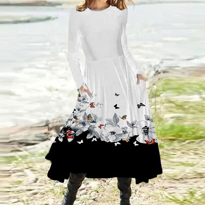 Women's flowing maxi dress with tie-dye circle pattern, round neckline, waist seam, and side pockets StylebySassy