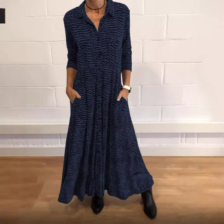 Ladies' flowing maxi dress with shirt collar, half-length sleeves, and side pockets StylebySassy