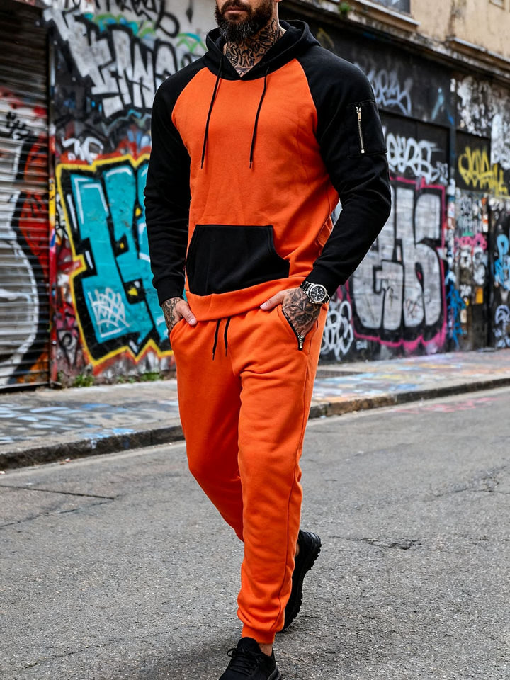 Men's two-piece hooded sweat set with raglan sleeves, sleeve zip pocket, and tapered jogging pants StylebySassy