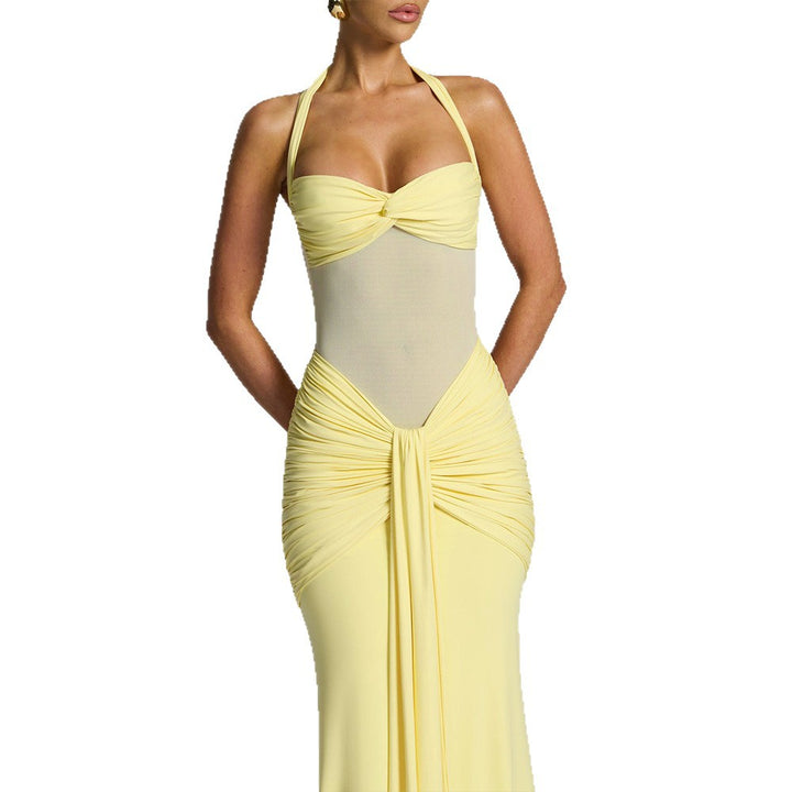 Women's figure-hugging halter evening dress with transparent mesh insert and gathered hip area StylebySassy