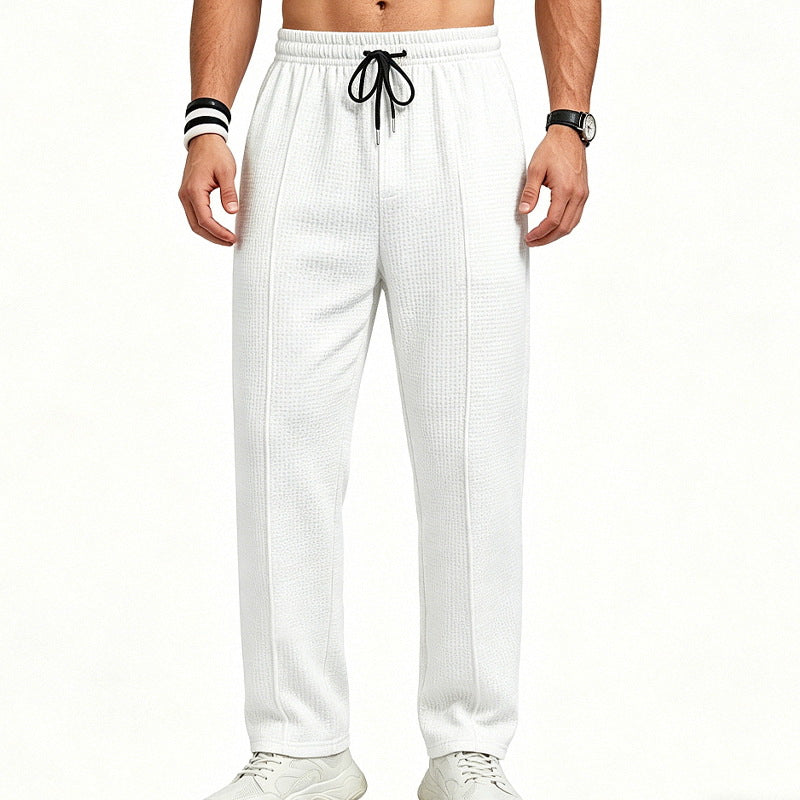 Men's straight-cut relaxed trousers with decorative center seam, elasticated drawstring waistband and side pockets StylebySassy