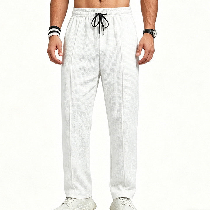 Men's straight-cut relaxed trousers with decorative center seam, elasticated drawstring waistband and side pockets StylebySassy