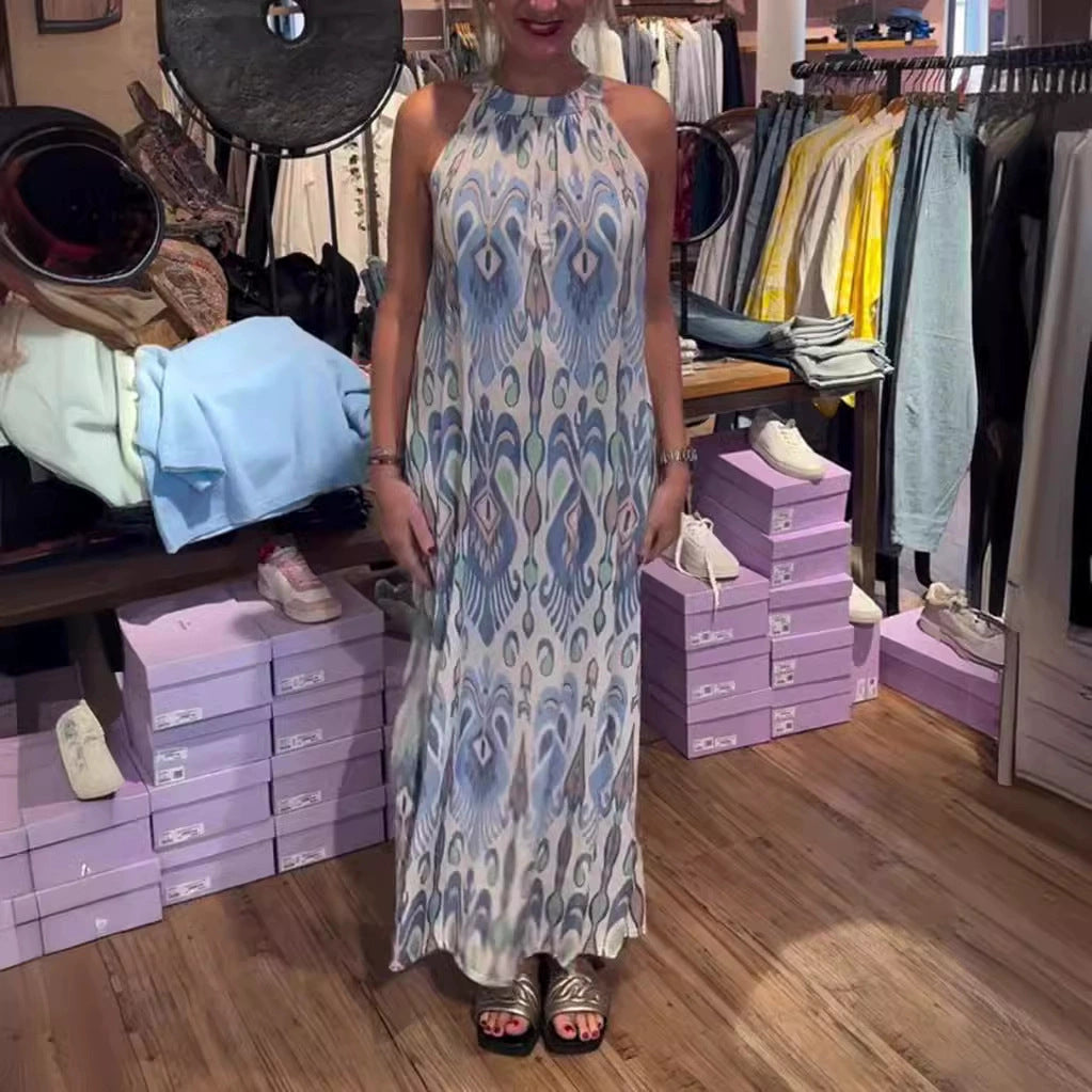 Women's flowing maxi dress with halter neck, ornamental ikat print and wide fall StylebySassy