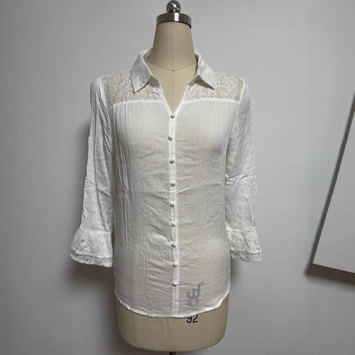 Ladies' semi-transparent crepe blouse with lace yoke, fabric-covered buttons, and three-quarter flounce sleeves StylebySassy