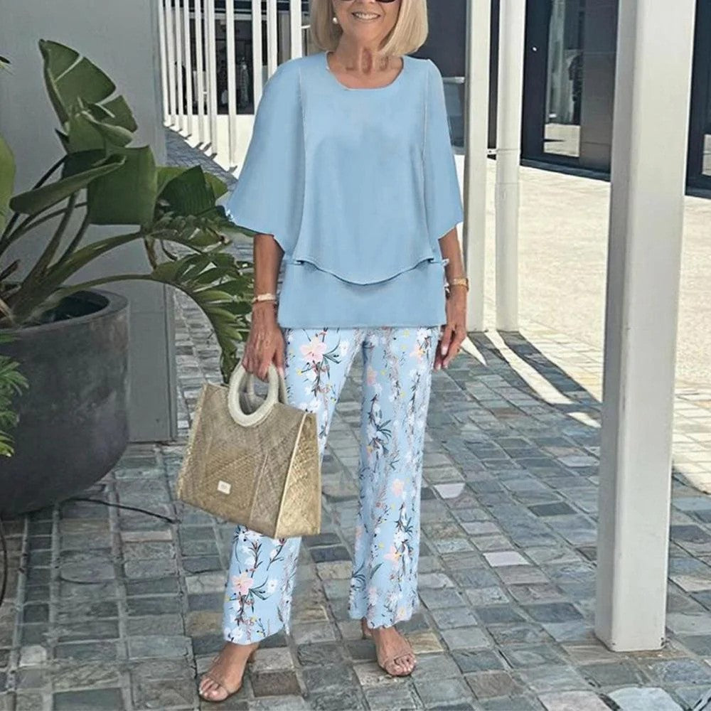 Women's layered tunic with cape sleeves and ankle-length straight leg pants with graphic print StylebySassy