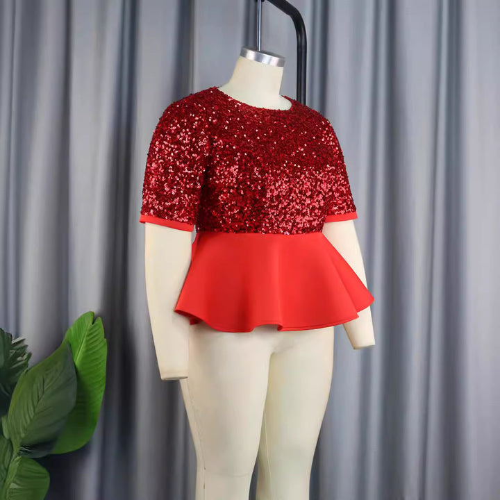 Ladies elegant glitter top with swinging peplum