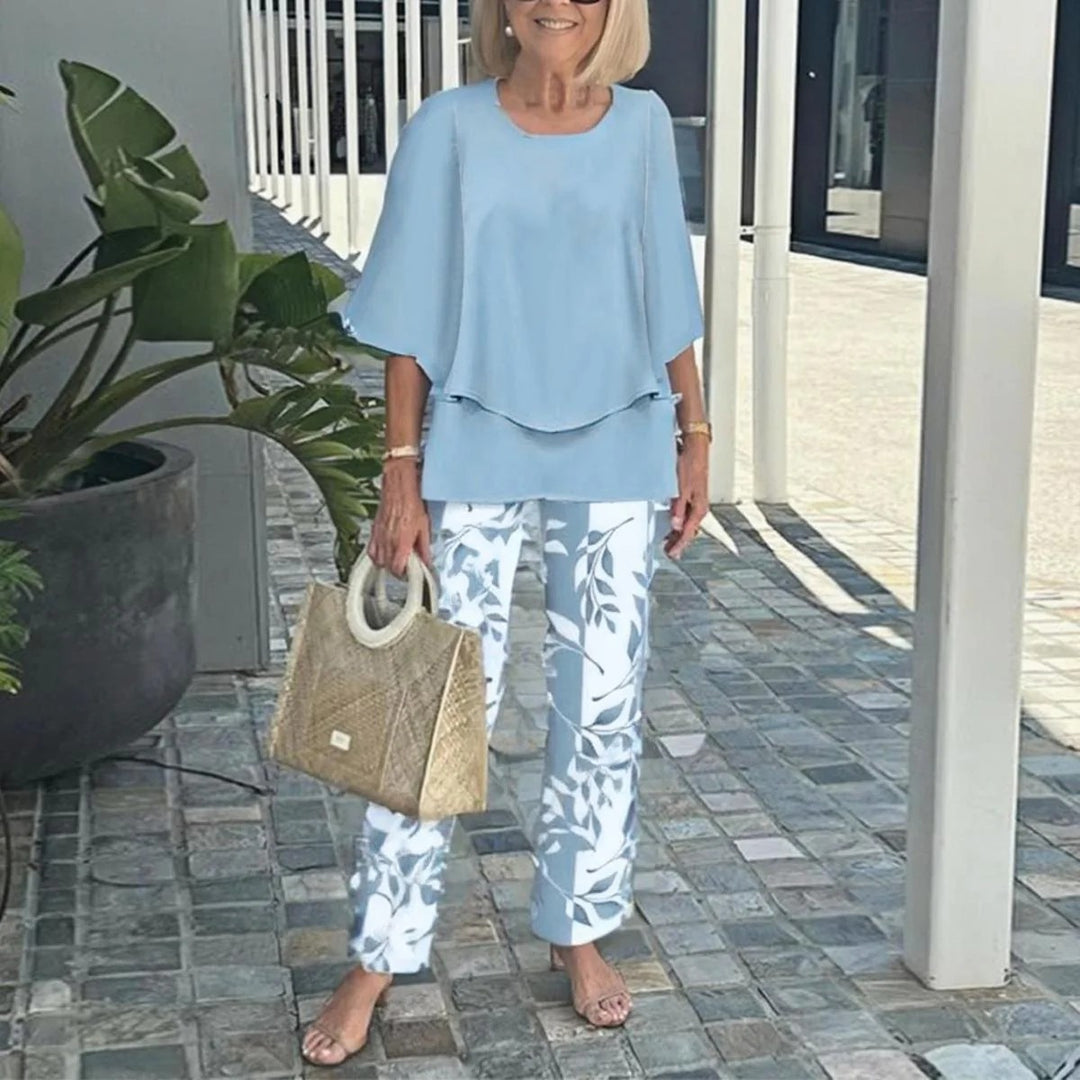 Women's layered tunic with cape sleeves and ankle-length straight leg pants with graphic print StylebySassy