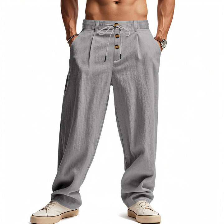 Men's casual pleated pants in linen look with elastic tunnel drawstring, decorative button placket, and deep side pockets StylebySassy