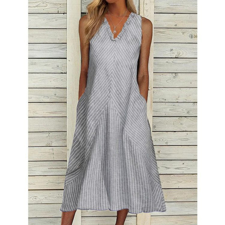 Women’s sleeveless A-line midi dress with ruffle V-neck, diagonal striped linen look and side pockets StylebySassy