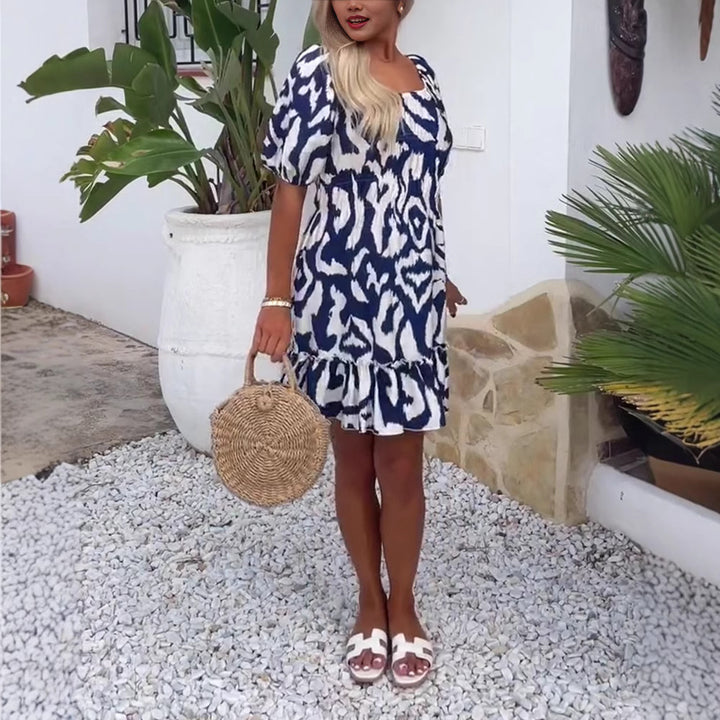 Women's short summer dress with square neckline, puff sleeves, and ruffle hem StylebySassy