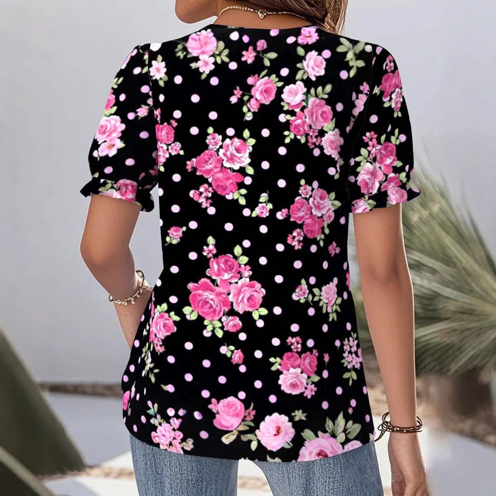 Ladies V-neck blouse with lace trim, puff sleeves and floral dot pattern StylebySassy