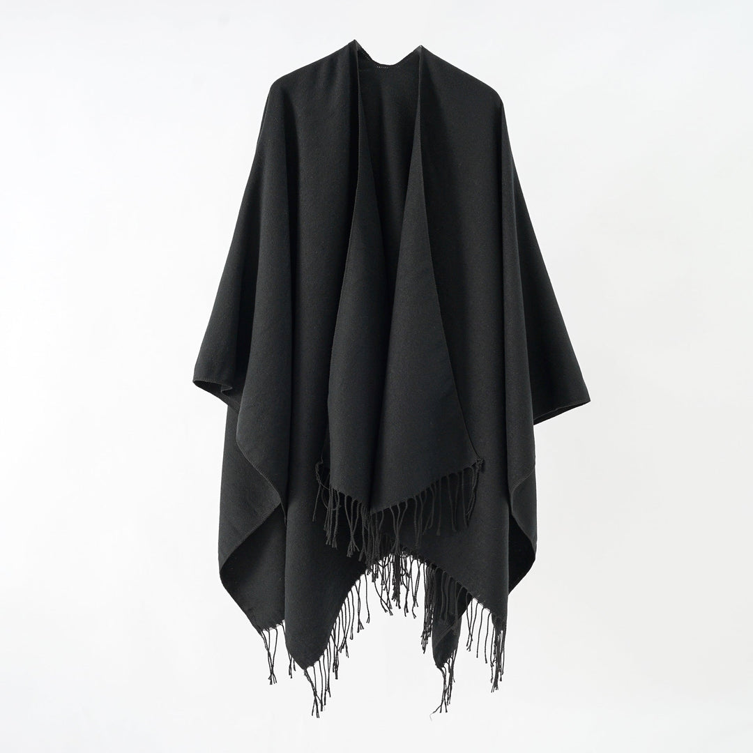 Women's fashionable fringe poncho made of soft material with luxurious drape StylebySassy