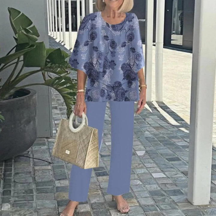Women's layered tunic with cape sleeves and ankle-length straight leg pants with graphic print StylebySassy