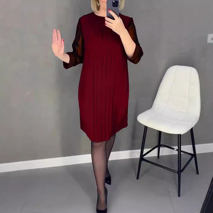 Ladies nan pleated sheath dress with knee-length silhouette and transparent three-quarter sleeves StylebySassy