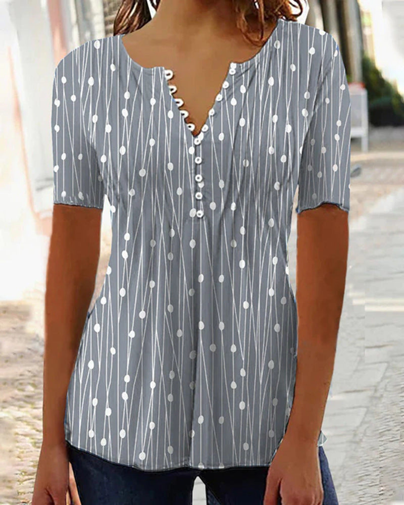 Women's airy V-neck blouse with short sleeves, decorative button placket and graphic dot stripe pattern StylebySassy