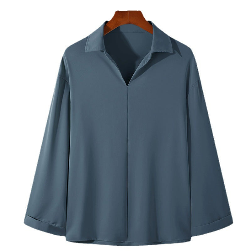 Women's loosely cut tunic blouse with deep V-neck, concealed button placket, and dropped shoulders StylebySassy
