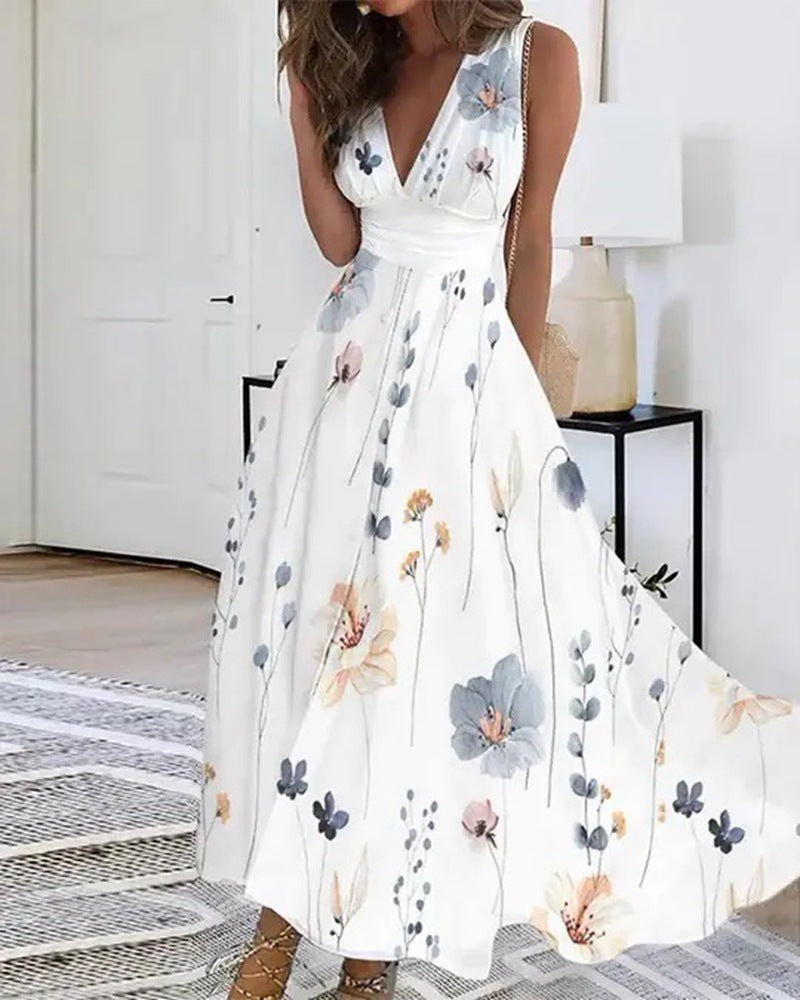 Women's flared midi dress with deep V-neck, empire waist and delicate floral print StylebySassy