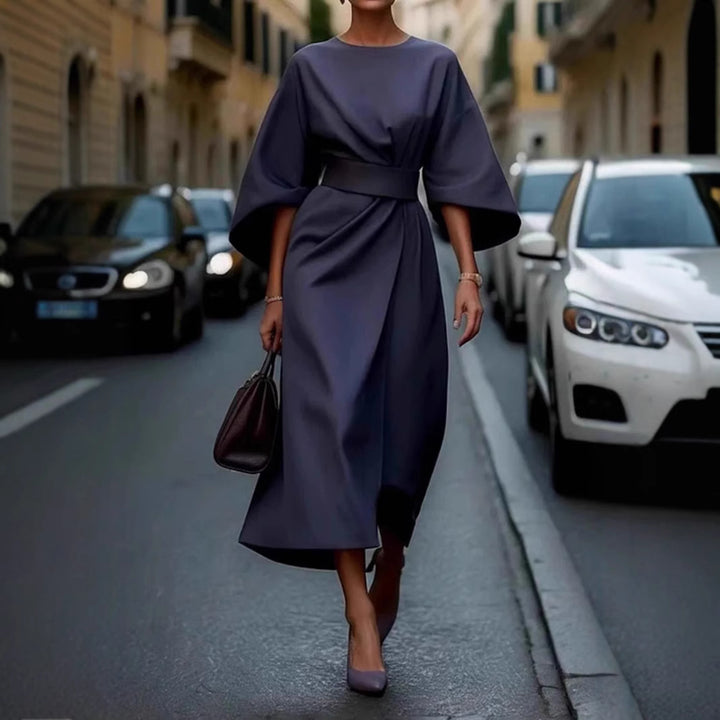 Women's minimalist evening dress with overlong wide sleeves and waist-sculpting pleat draping StylebySassy