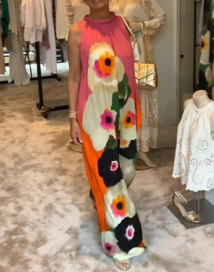 Women's sleeveless maxi dress with ruffled high collar, wide palazzo cut, and large floral print StylebySassy