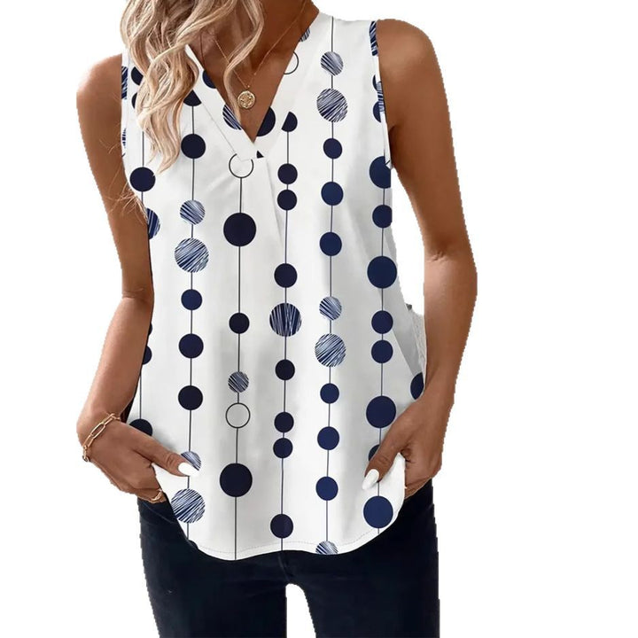 Women's V-neck blouse top with vertical polka dot pattern and subtle center seam StylebySassy