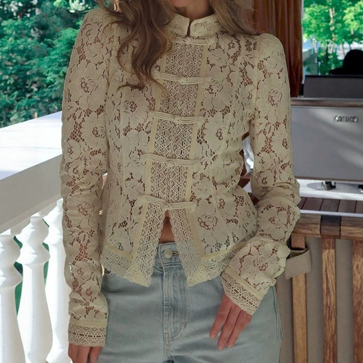 Women's figure-hugging lace blouse with stand collar, decorative knot closure, and crocheted hem StylebySassy