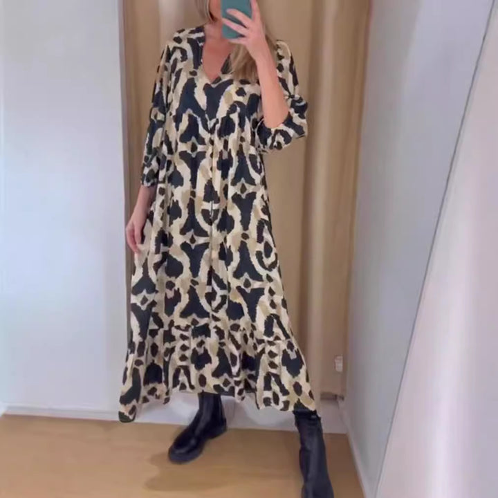 Women's flowing tiered maxi dress with V-neck, gathered bust panel and three-quarter sleeves StylebySassy