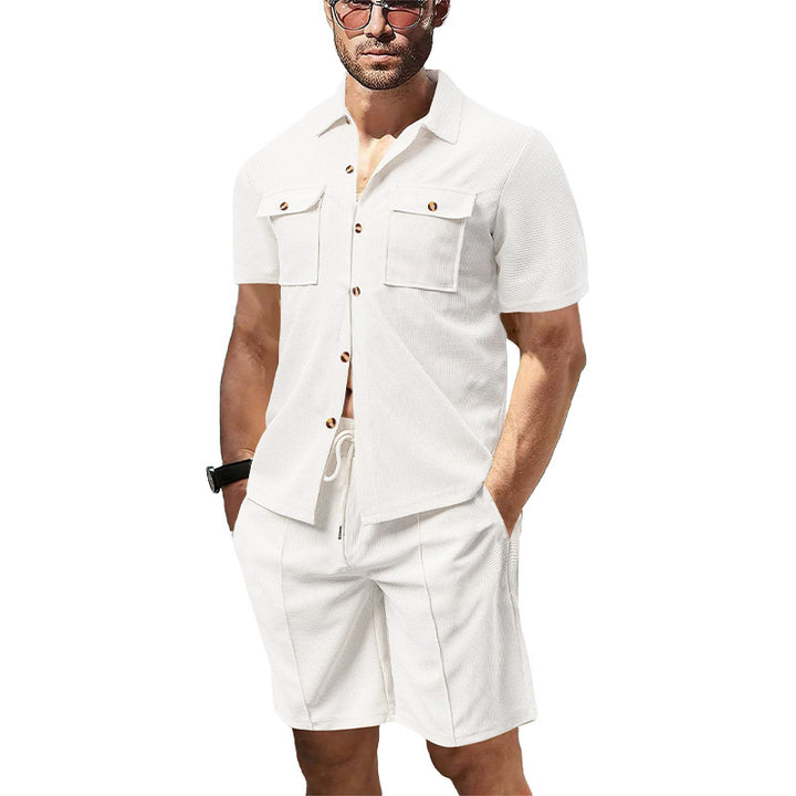 Men's modern short-sleeve shirt set in resort style with patch pockets, open lapel collar, and drawstring Bermuda shorts made of textured jersey StylebySassy