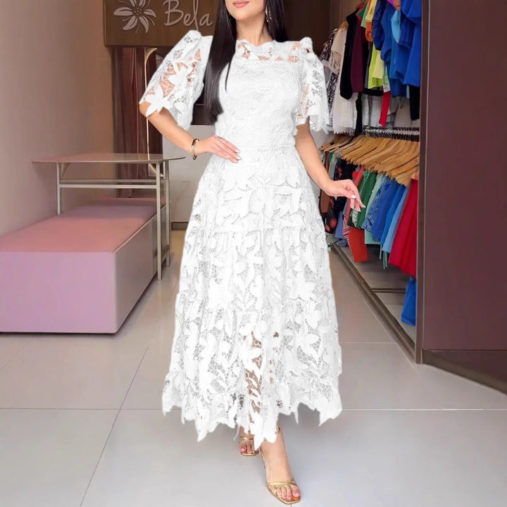 Women's maxi dress made of floral guipure lace with a fitted silhouette and tiered hem StylebySassy