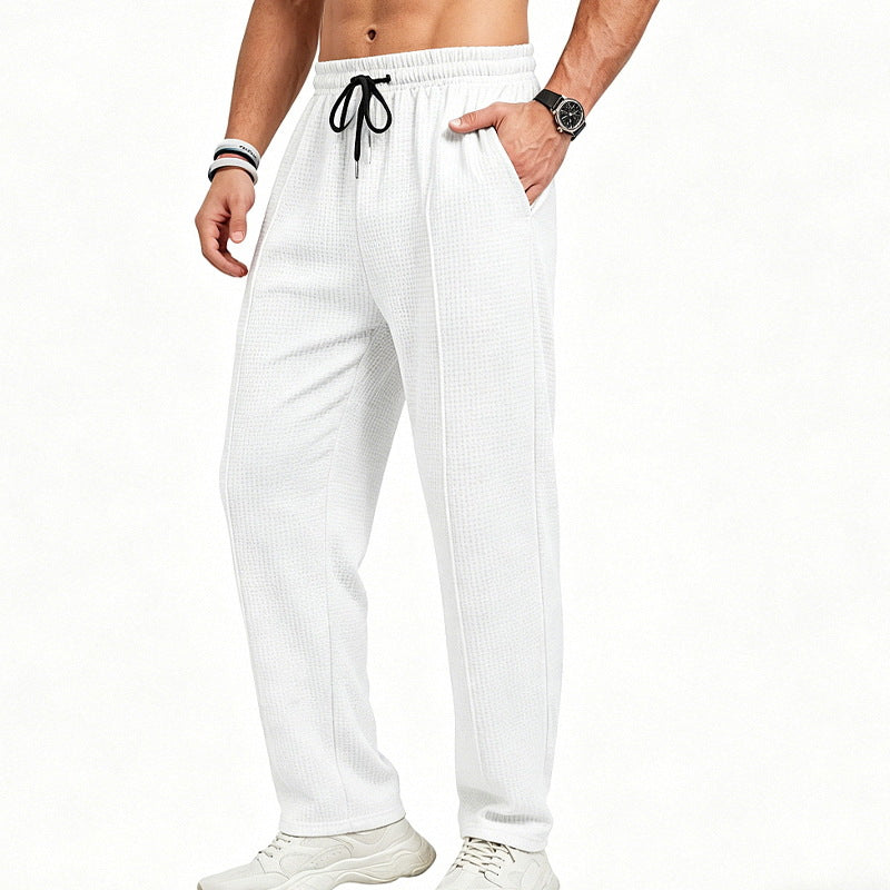 Men's straight-cut relaxed trousers with decorative center seam, elasticated drawstring waistband and side pockets StylebySassy