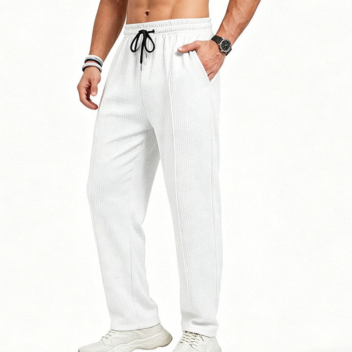 Men's straight-cut relaxed trousers with decorative center seam, elasticated drawstring waistband and side pockets StylebySassy
