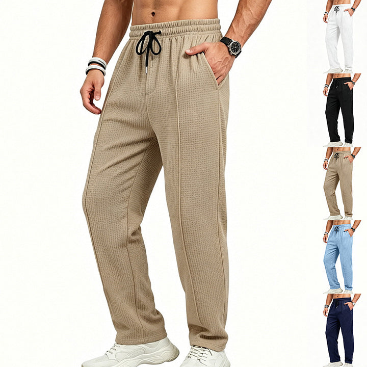 Men's straight-cut relaxed trousers with decorative center seam, elasticated drawstring waistband and side pockets StylebySassy