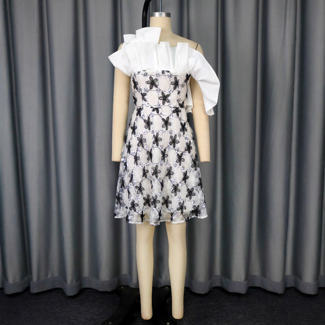 Women’s festive cocktail dress with flowing cut and intricate flower appliqués StylebySassy