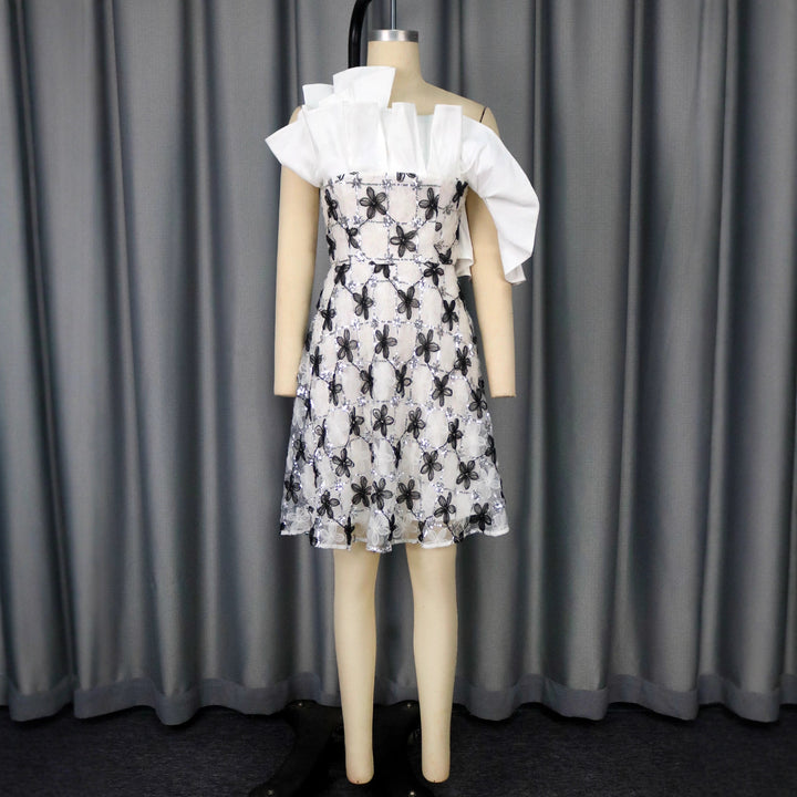 Women’s festive cocktail dress with flowing cut and intricate flower appliqués StylebySassy