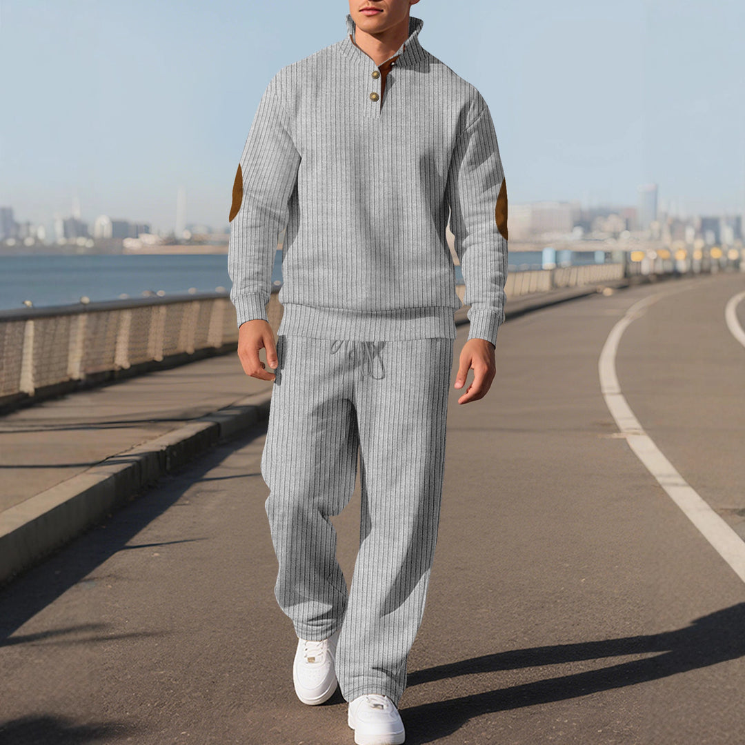 Men's fine ribbed sweater with half button placket, high stand-up collar, and contrasting suede elbow patches StylebySassy