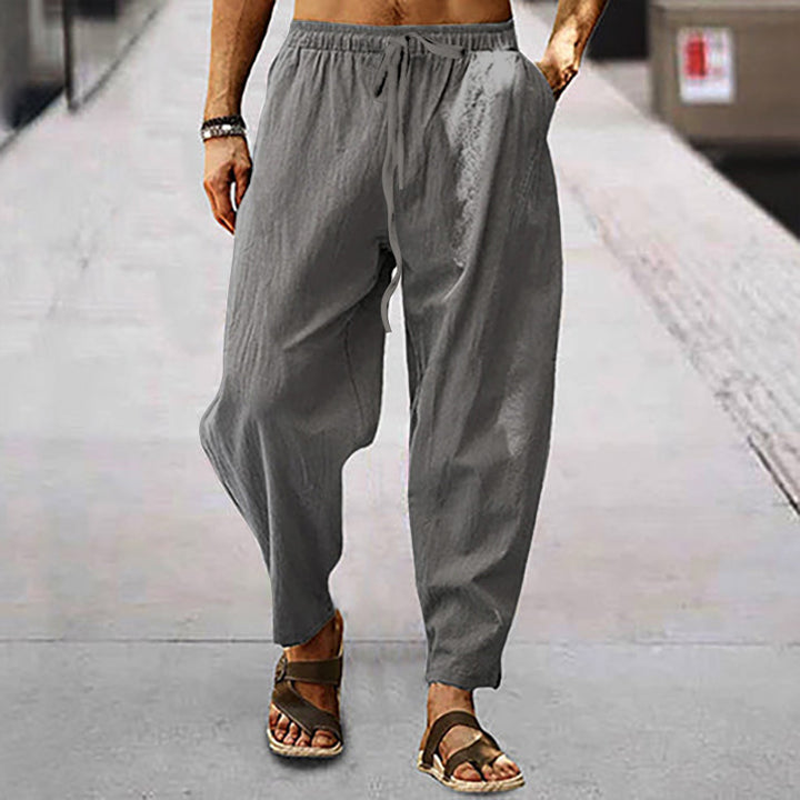 Men's relaxed summer slouch pants made of linen blend with elastic waistband and tapered ankle cuffs StylebySassy